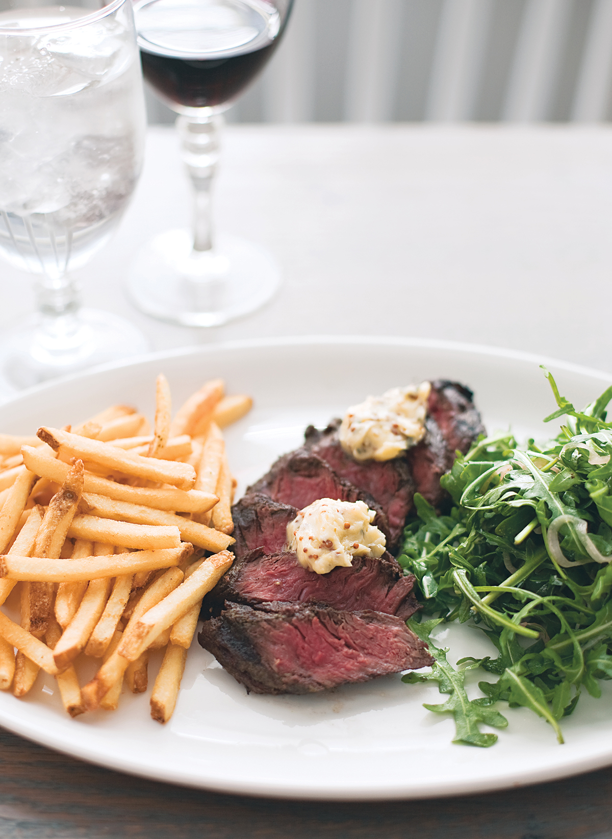 steak frites at woodward in the ames hotel. Photograph by Keller + Keller.