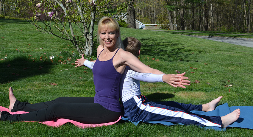 Julie and her son doing a Spine Twist. (Photo provided.)