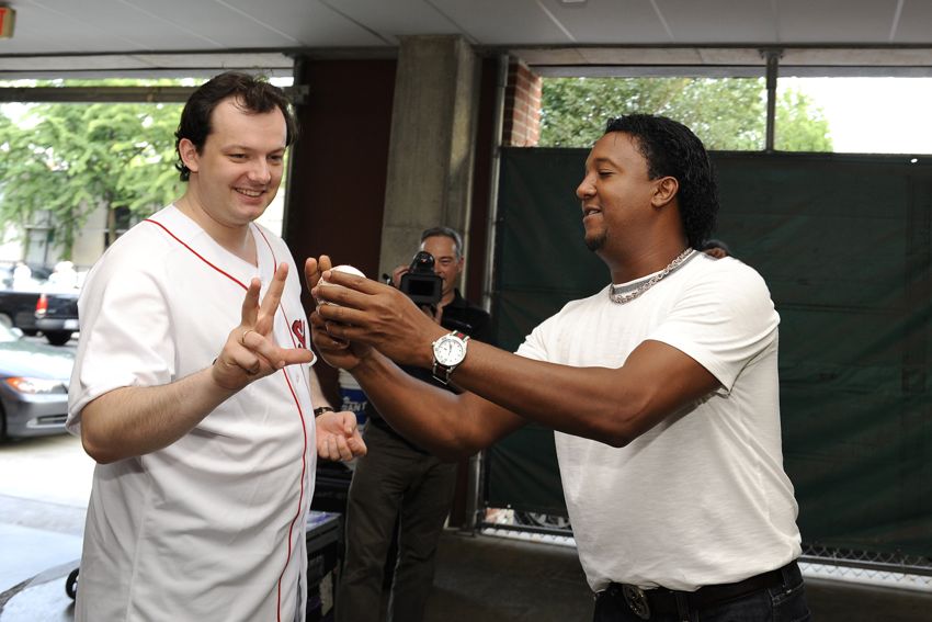 Pedro Martinez gives Andris Nelsons a lesson before he throws out the first pitch at Fenway Park. (Photo by Stu Rosner)