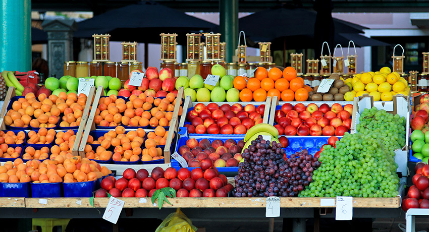 That's one way to get kids to eat fruits and vegetables. Give them no other choice. Fruit stand photo via Shutterstock.