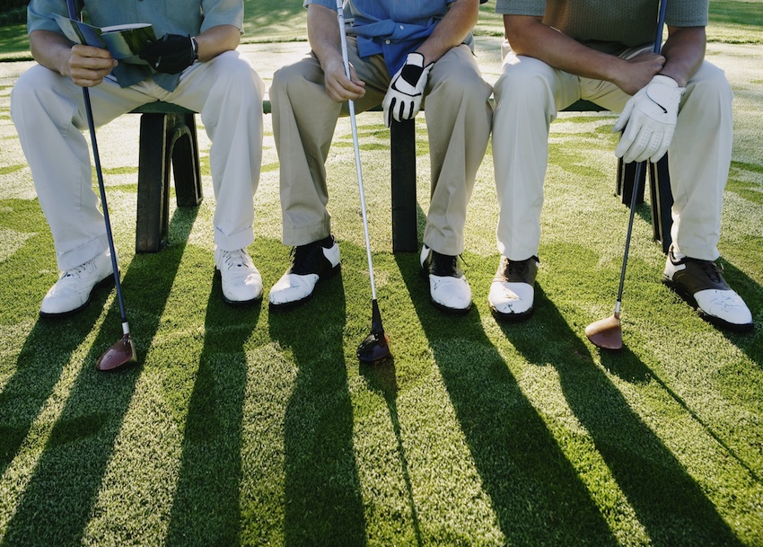 Male golfers over the age of 50 are at risk for melanoma. Golfers bench image via Shutterstock.