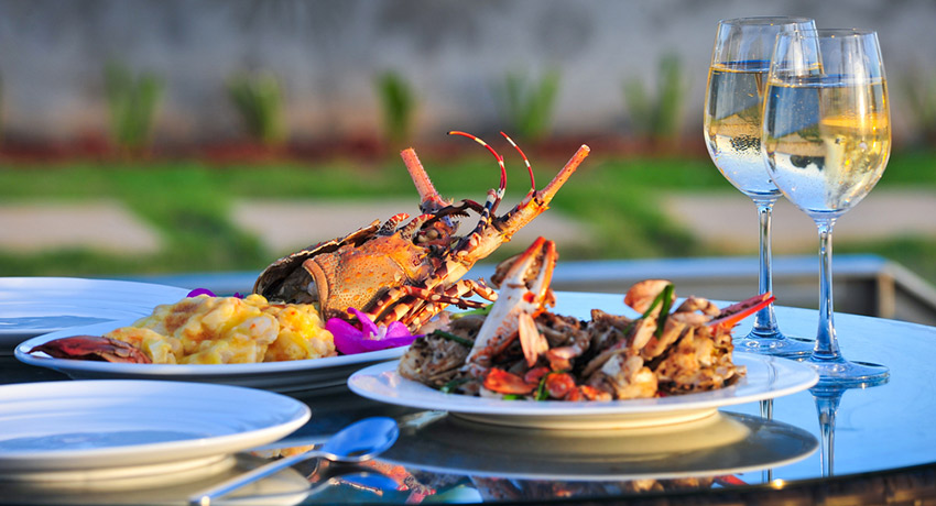Summer alfresco dining and lobster go perfectly together. Lobster dinner photo via shutterstock. 
