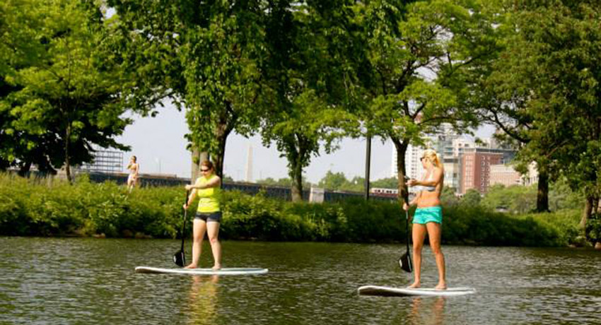 Paddleboarding on the Charles. Photo via By Land and Sea stand Up Paddle Facebook