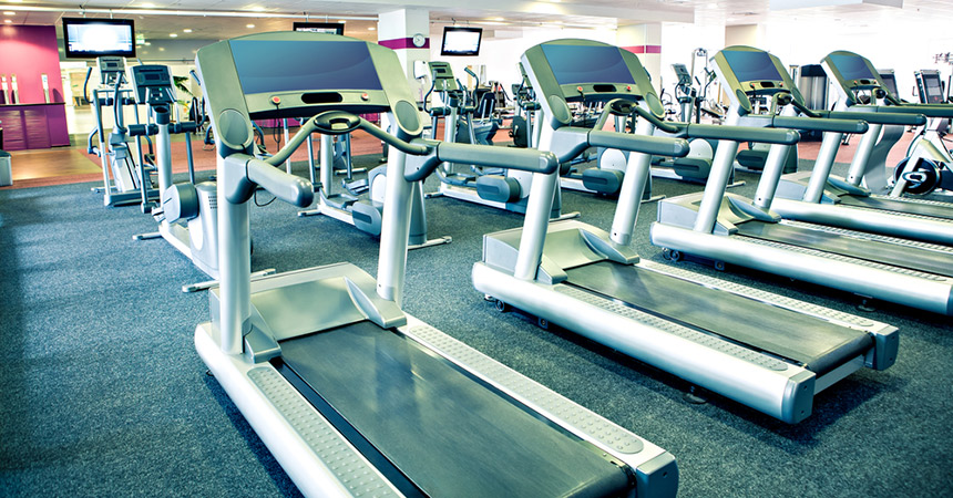 Those treadmills can be intimidating after a long holiday weekend. Gym photo via shutterstock.
