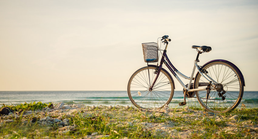 Bike at the beach photo via shutterstock