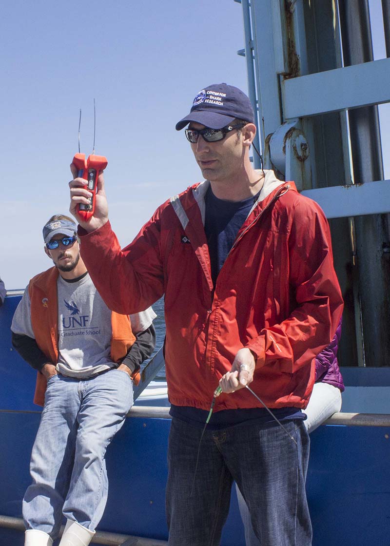 Nick Whitney, staff scientists at Mote Marine in Florida, shows off an accelerometer/ Photo by Olga Khvan