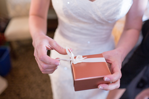 Bride Holding Gift Photo via Shutterstock