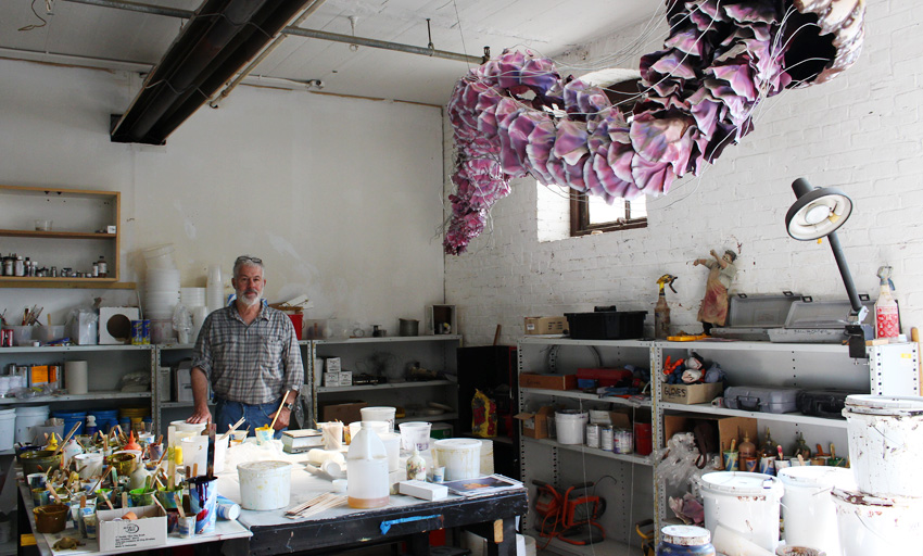 Peter Brady stands in his Charlestown studio. (Photo by Margaret Burdge)