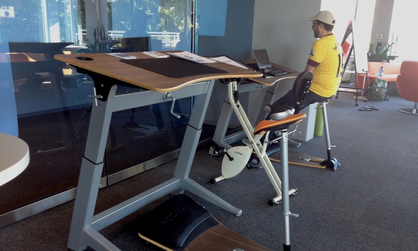 One man works at an innovative desk before the final presentation. Photo by Jenni Whalen.