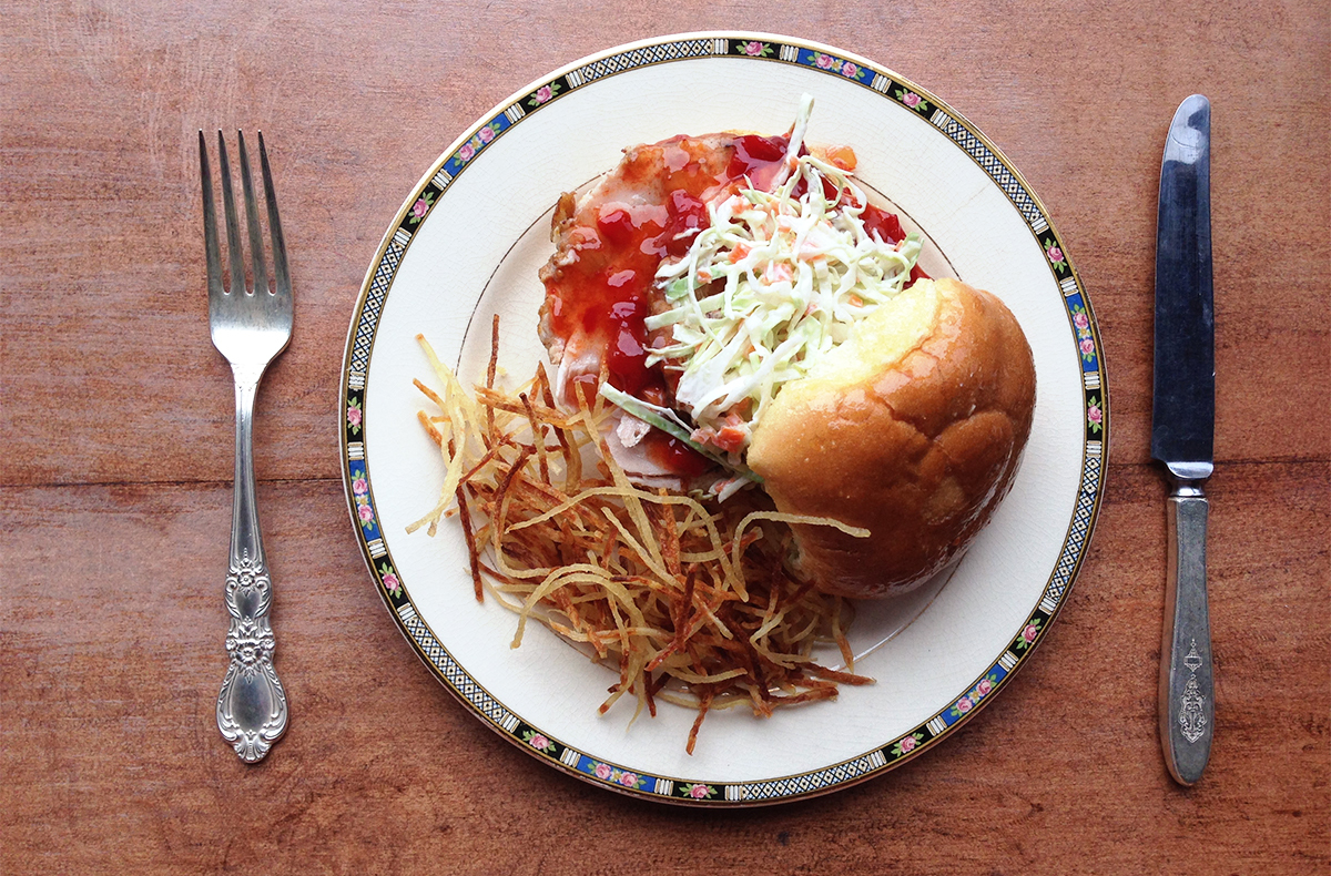 Chef Jason Albus's new pork slice sandwich with chow-chow.