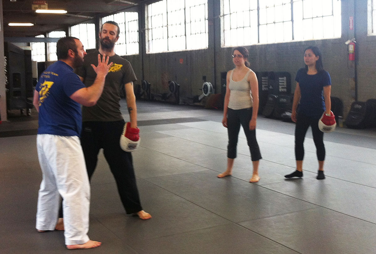 Instructor Gershon Ben Keren demonstrating a defense move with his assistant, photo by Stephanie Cohn 