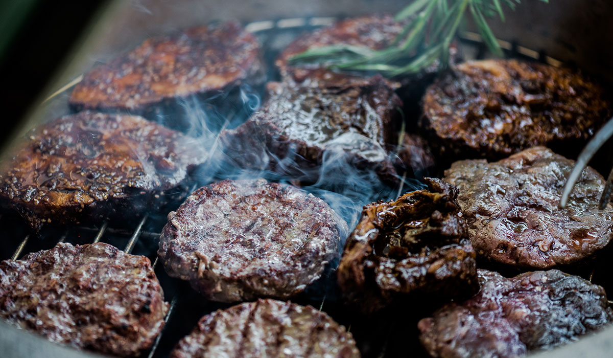 burgers on a grill image via shutterstock