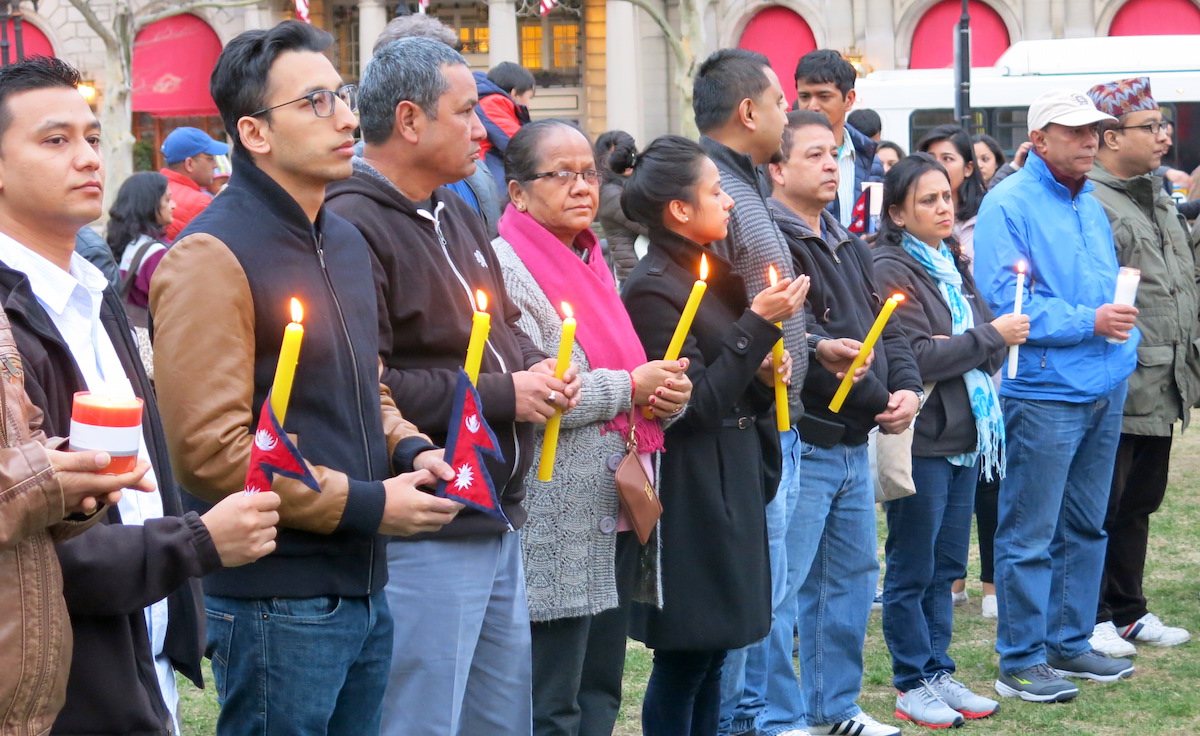 A crowd gathers at vigil in Copley Square to remember the victims of the earthquake in Nepal. 