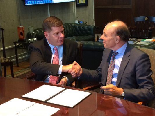 Mayor Marty Walsh and Netherlands consul general Rob de Vos shake hands after signing an agreement to cooperate on flood management Wednesday.