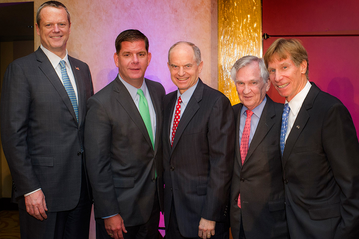 (From Left to Right) Governor of Massachusetts Charles M. Baker, Mayor of Boston Martin J. Walsh, Josh Bekenstein, managing director at Bain Capital/DFCI and PMC board member, Edward J. Benz, Jr., MD, president. Photograph at the Heavy Hitters Dinner, provided. 