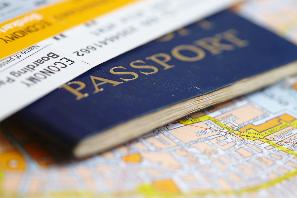 Passport on map via Shutterstock
