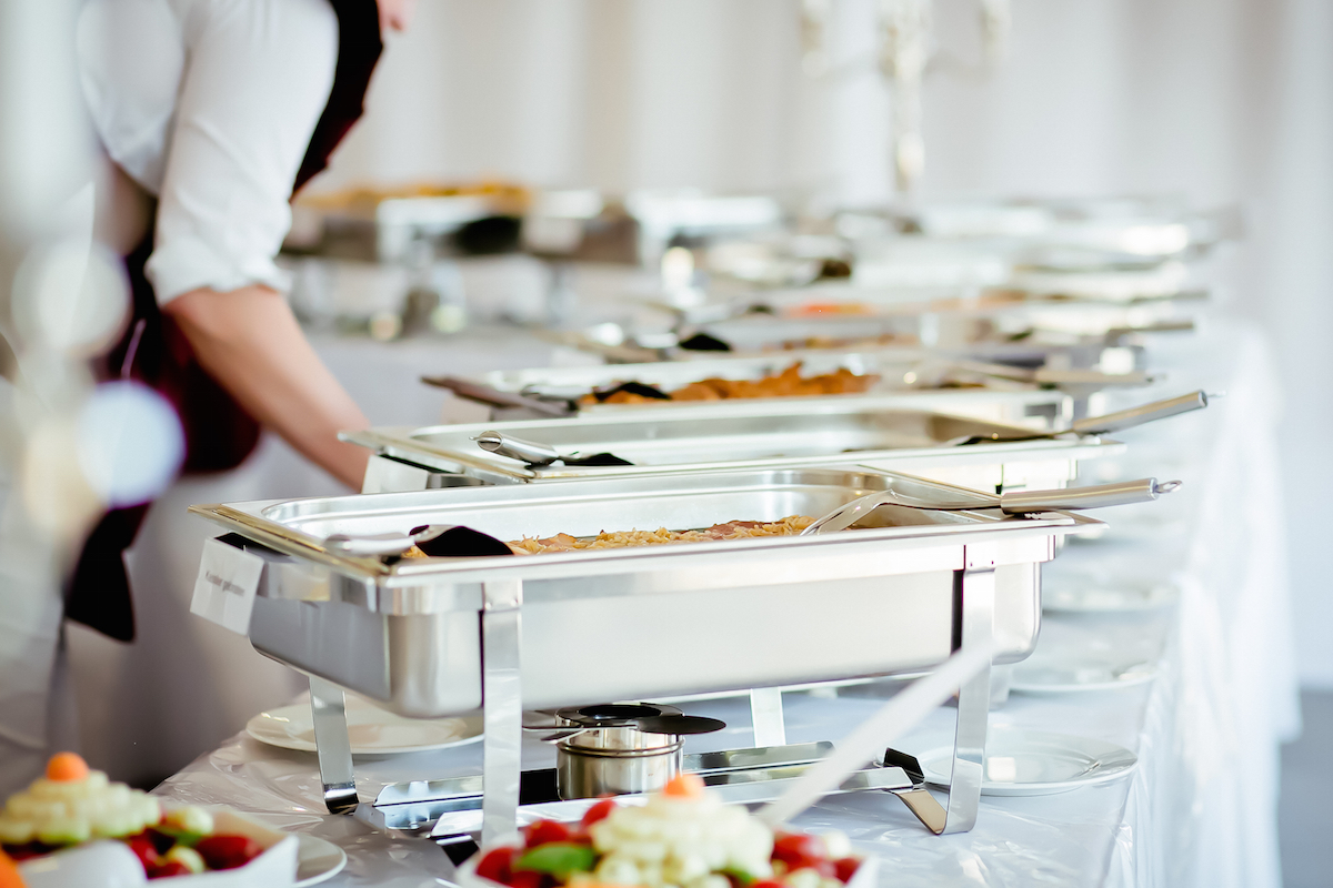 Caterer eat food wedding via Shutterstock