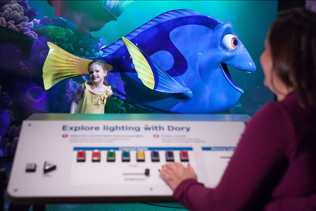 Visitors adjust lighting to recreate a scene from Finding Nemo