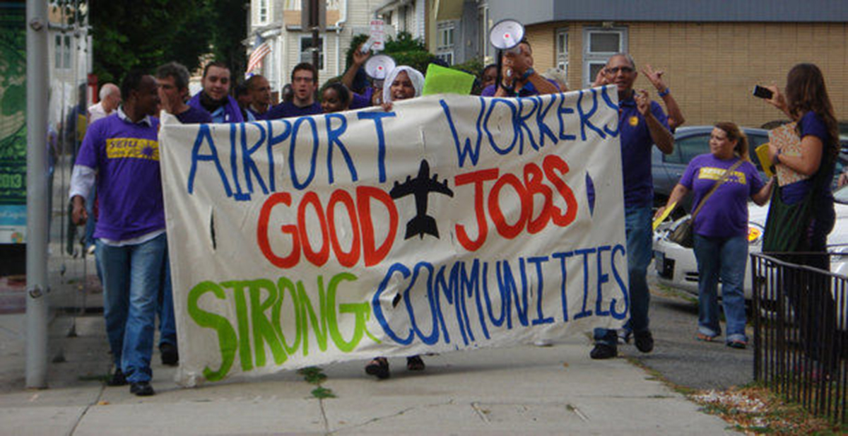 Workers protesting at Logan Airport in June. Photo via SEIU 32BJ