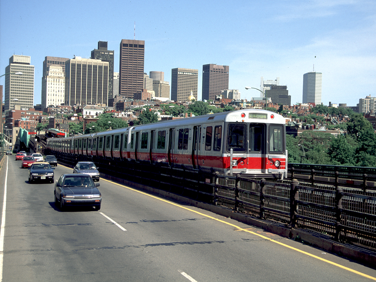 Red Line train traveling on Longfellow Bridge. Photo via Mass. Office of Tourism. 
