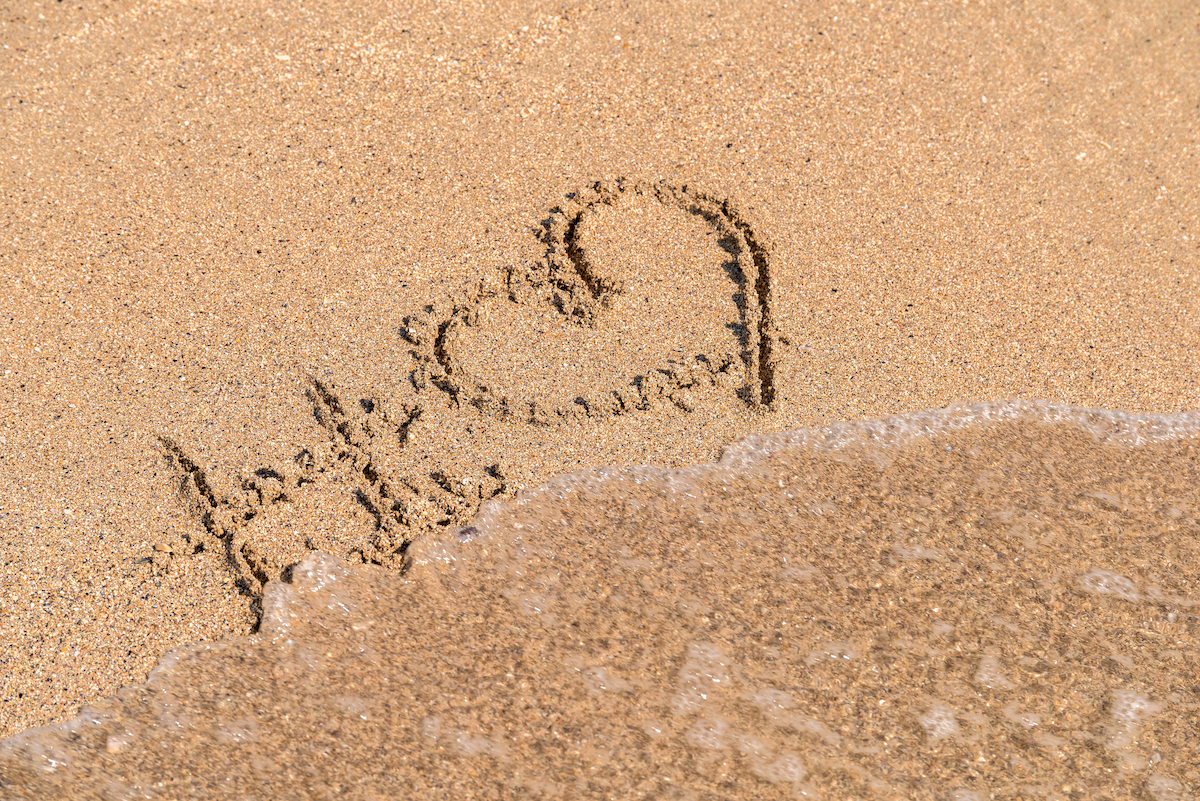 Hashtag Love Heart Sign On Beach Sand via Shutterstock