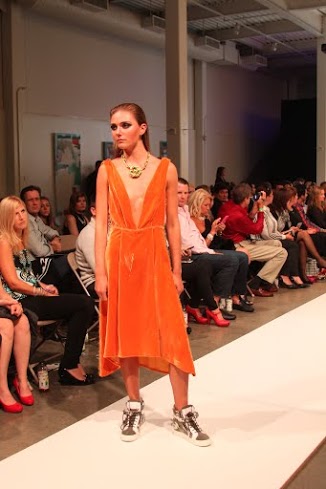 A nature-inspired collection by Kanjana Amato featured a showstopping orange velvet frock. / Photo by Summer Lin