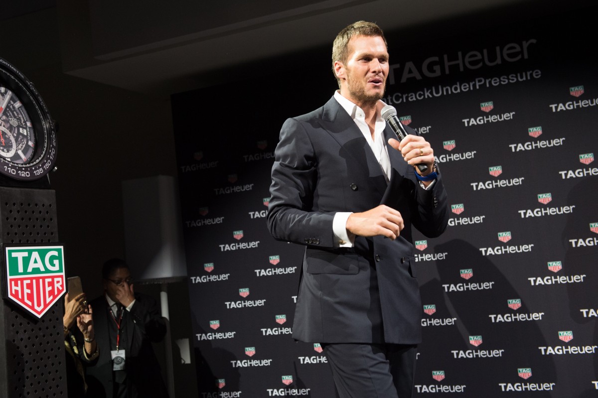 Football player Tom Brady is seen on stage at a TAG Heuer watch launch and brand ambassador announcement event at Spring Studios on Tuesday, Oct. 13, 2015, in New York. (Photo by Scott Roth / Invision / AP)