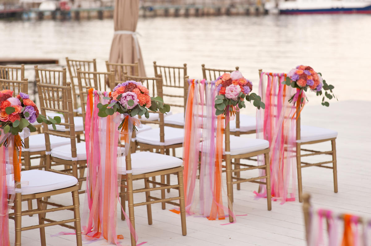 Floral arrangement at a wedding ceremony on the beach via Shutterstock