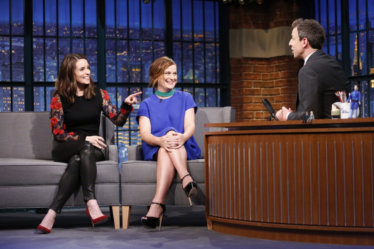 LATE NIGHT WITH SETH MEYERS -- Episode 304 -- Pictured: (l-r) Tina Fey and Amy Poehler during an interview with host Seth Meyers on December 17, 2015 -- (Photo by: Lloyd Bishop/NBC)