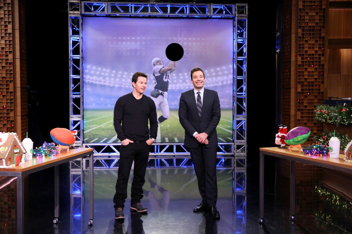 THE TONIGHT SHOW STARRING JIMMY FALLON -- Episode 0388 -- Pictured: (l-r) Actor Mark Wahlberg and host Jimmy Fallon play Random Object Football Toss on December 15, 2015 -- (Photo by: Douglas Gorenstein/NBC)