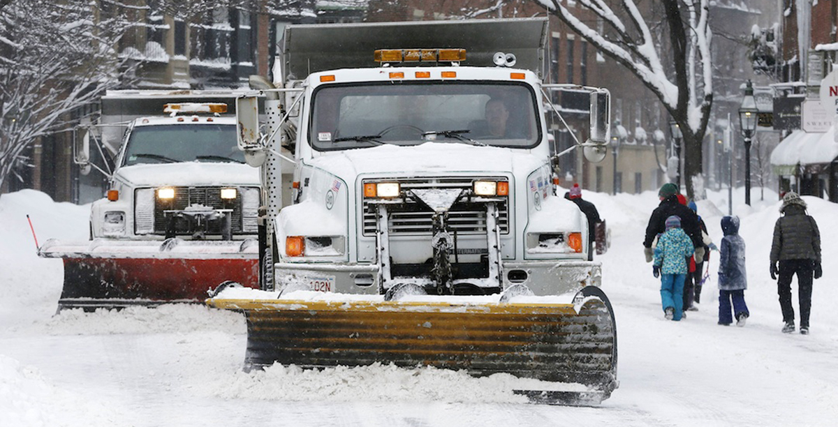 Plows clear Charles Street in Boston. 