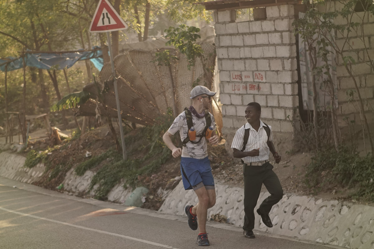 Owen Mattison, left, was joined by an young man for part of last year's run across Haiti. 