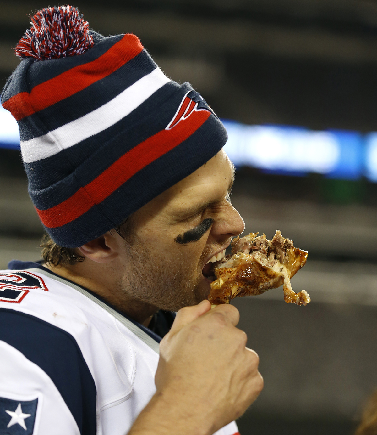 New England Patriots quarterback Tom Brady holds a turkey leg after an NFL football game against the New York Jets Thursday, Nov. 22, 2012 in East Rutherford, N.J. The Patriots won the game 49-19. / Photo by Julio Cortez via AP