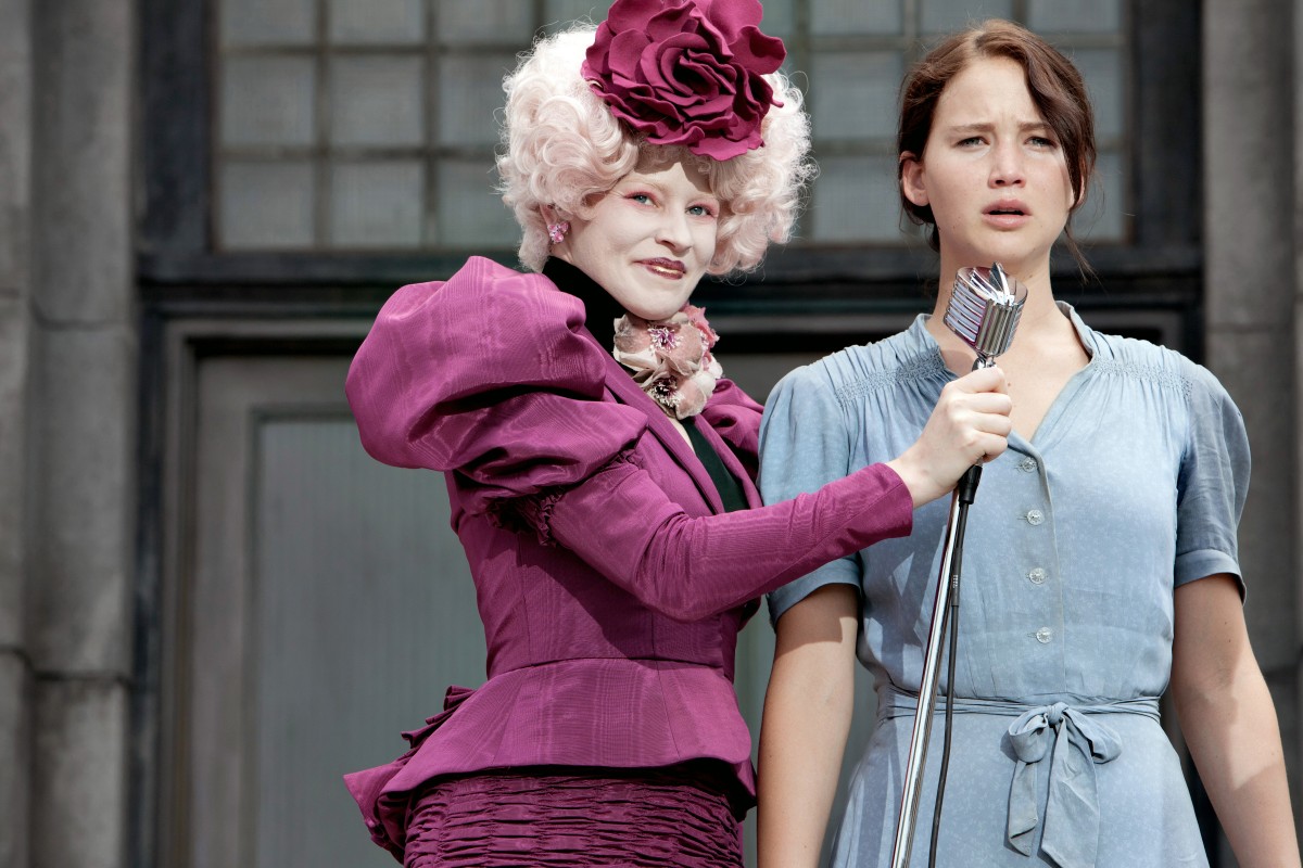 From left to right: Elizabeth Banks ("Effie Trinket," left) and Jennifer Lawrence ("Katniss Everdeen," right) star in Lionsgate Home Entertainment's THE HUNGER GAMES. Photo credit: Murray Close