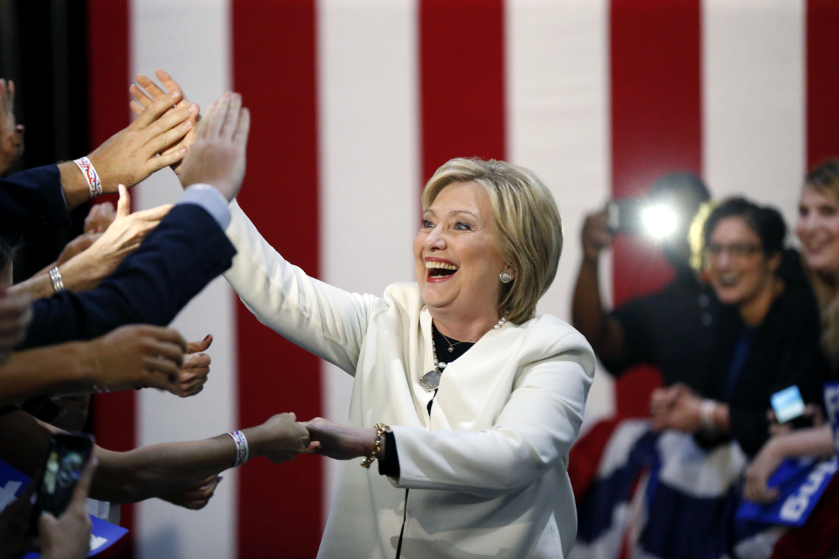 Democratic presidential candidate Hillary Clinton reacts to supporters as she arrives to speak at her Super Tuesday election night rally in Miami, Tuesday, March 1, 2016. (AP Photo/Gerald Herbert)