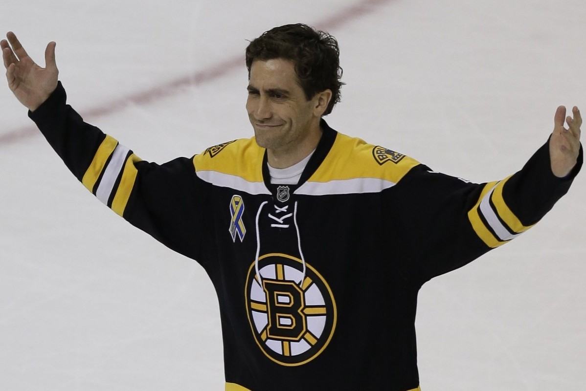Actor Jake Gyllenhaal, portraying Boston Marathon bombing survivor Jeff Bauman, thanks the crowd of Boston Bruins fans after filming a scene from a feature film about the bombing on the ice of Boston Garden, Tuesday, April 5, 2016. (AP Photo/Charles Krupa)