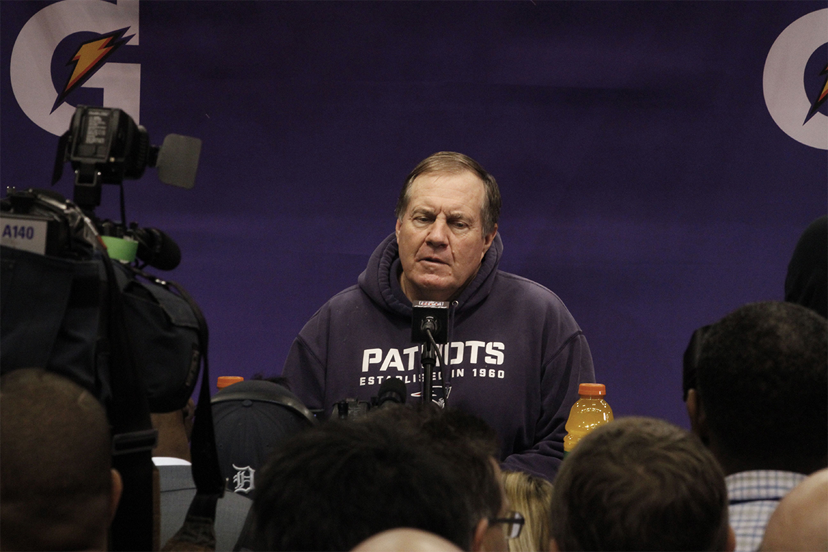 Bill Belichick at the podium on Super Bowl XLIX media day by WEBN-TV on Flickr/Creative Commons