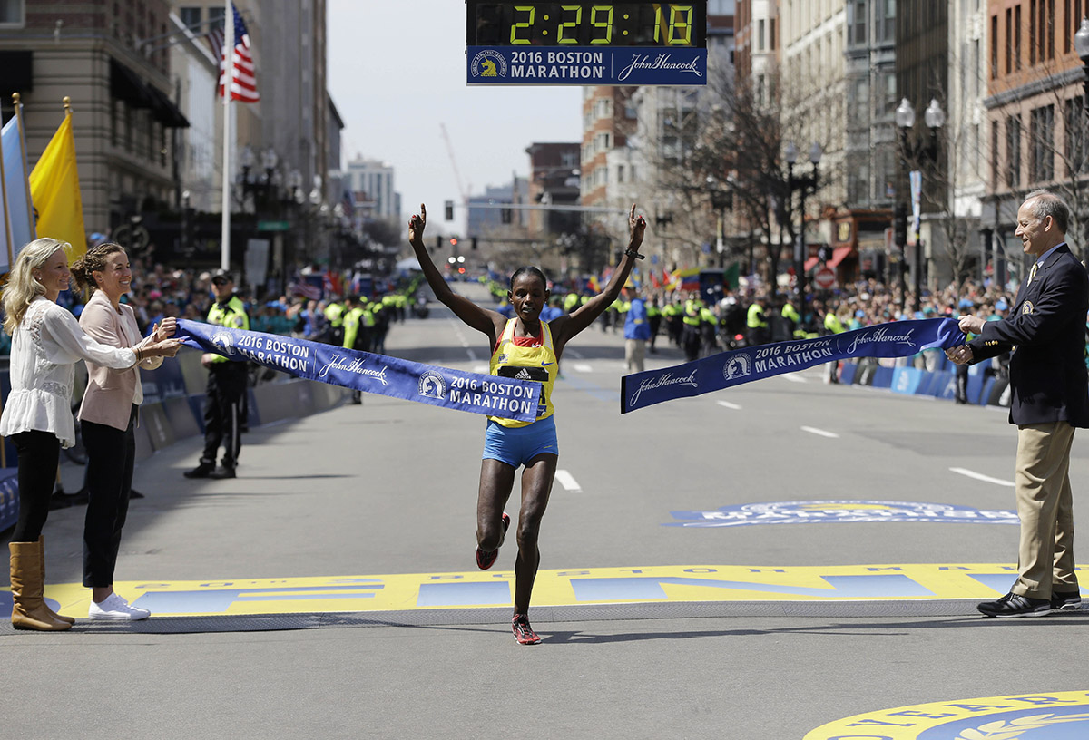 Atsede Baysa breaks the tape to win the women's division. / Photo via AP