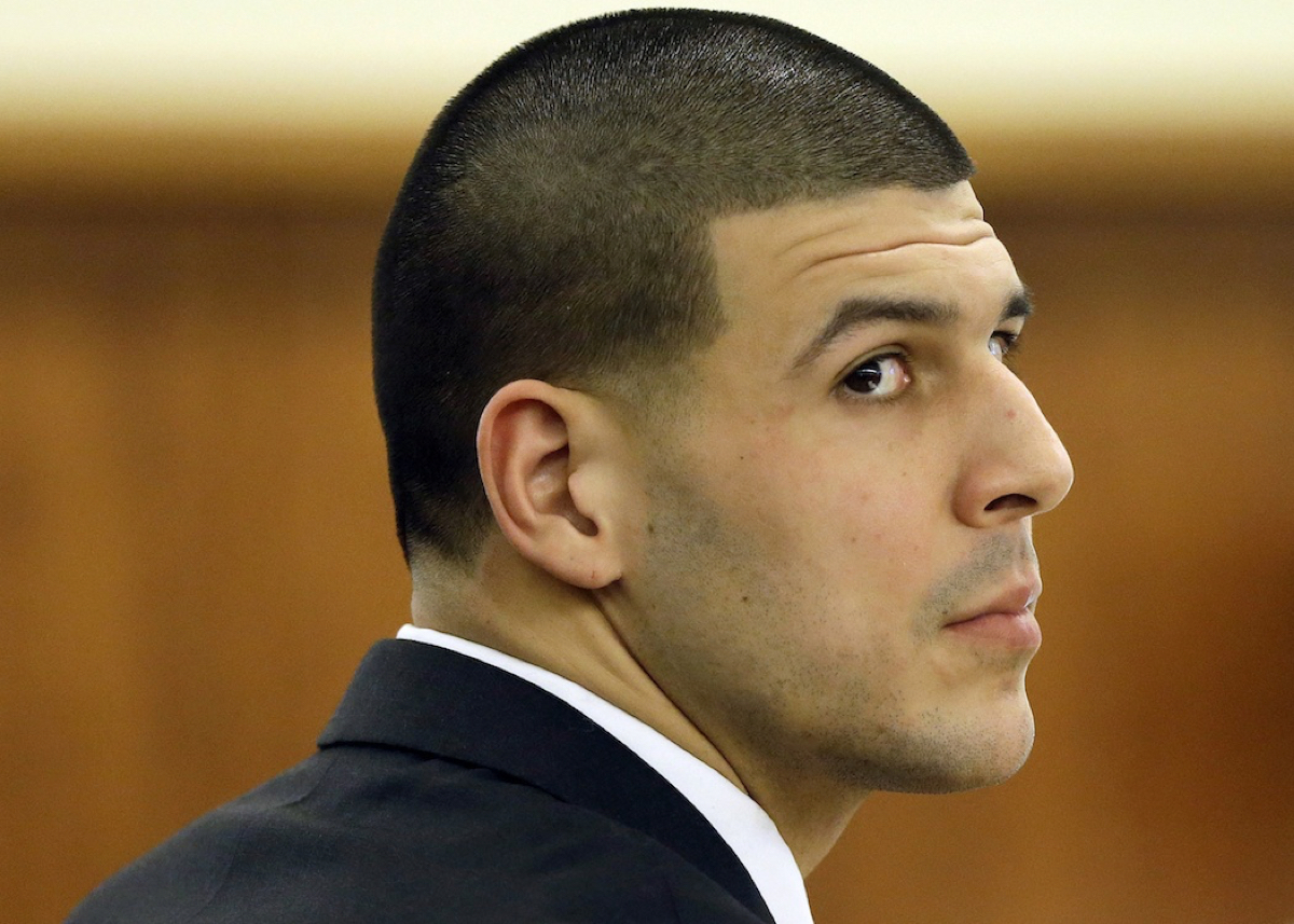 Former New England Patriots football player Aaron Hernandez listens during his murder trial, Thursday, Jan. 29, 2015, in Fall River, Mass. Hernandez is charged with killing semiprofessional football player Odin Lloyd, 27, in June 2013. (AP Photo/Steven Senne, Pool)