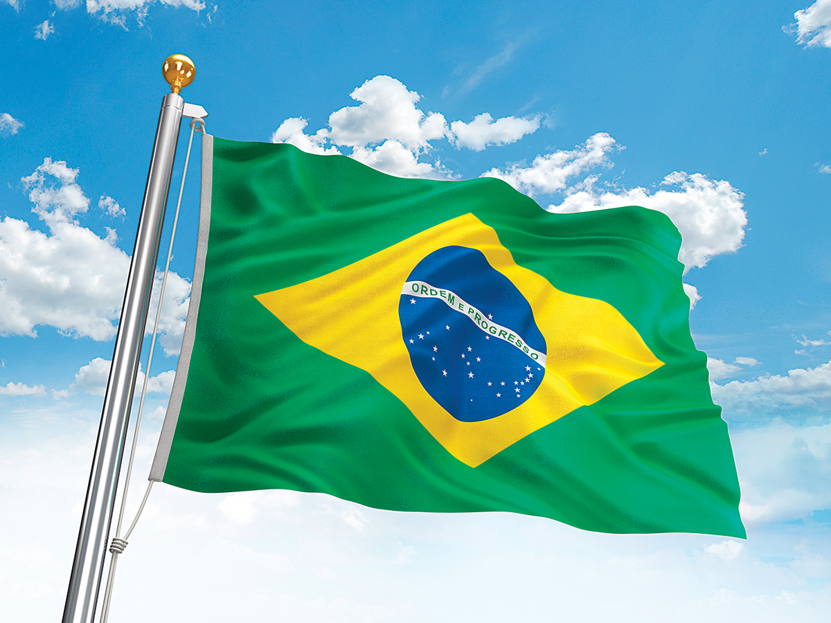 Waving Brazil flag against cloudy sky. High resolution 3D render.