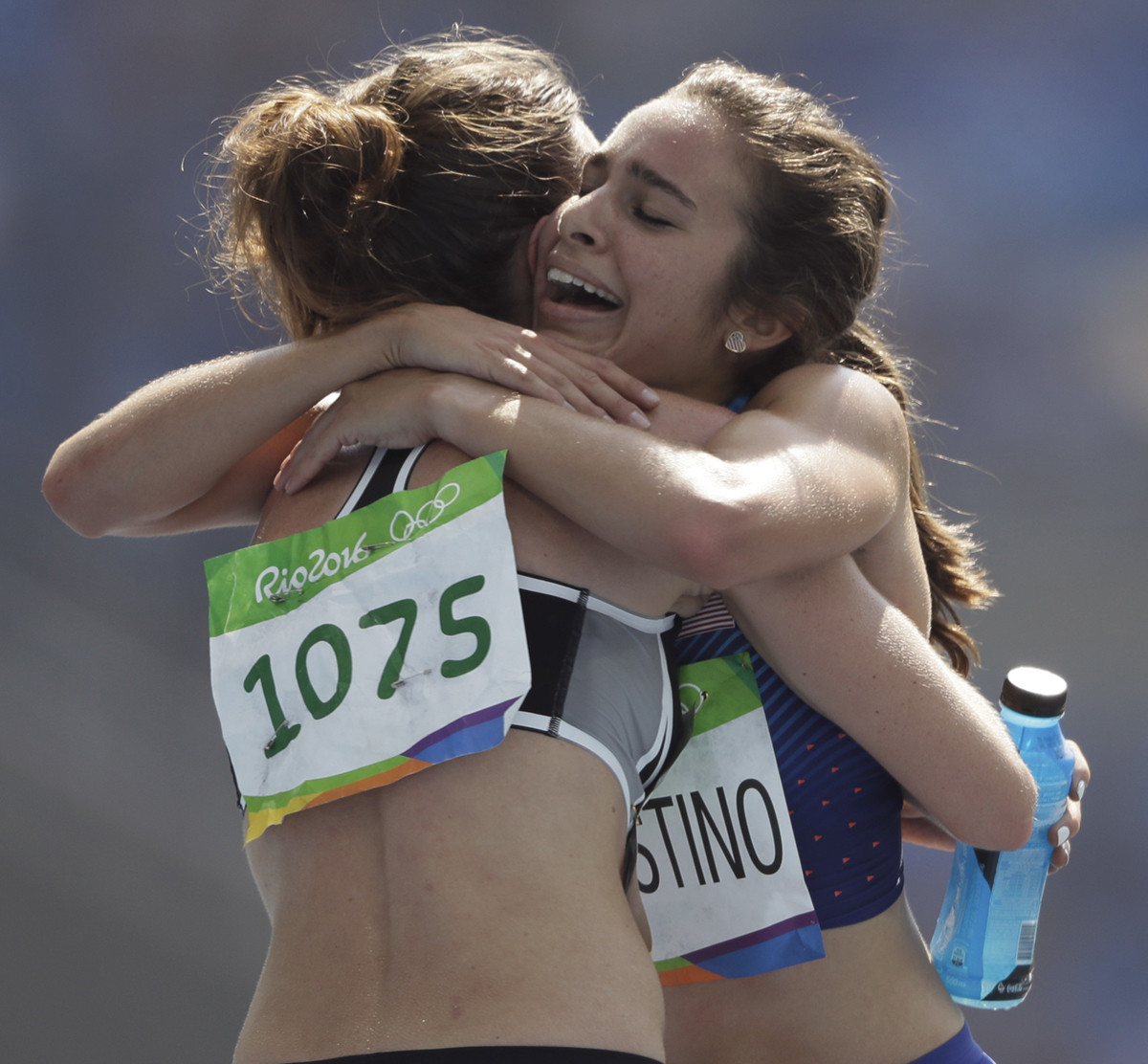 New Zealand's Nikki Hamblin, left, and United States' Abbey D'Agostino after competing in a women's 5000-meter heat during the athletics competitions of the 2016 Summer Olympics at the Olympic stadium in Rio de Janeiro, Brazil, Tuesday, Aug. 16, 2016. (AP Photo/David J. Phillip)