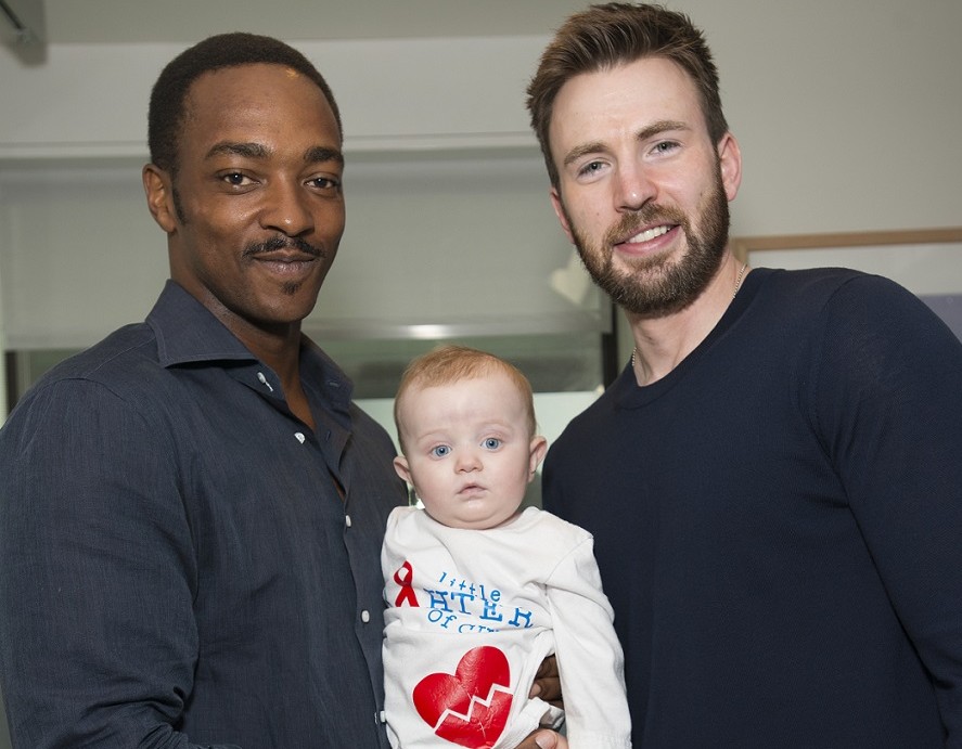 Anthony Mackie and Chris Evans with a patient at MGH