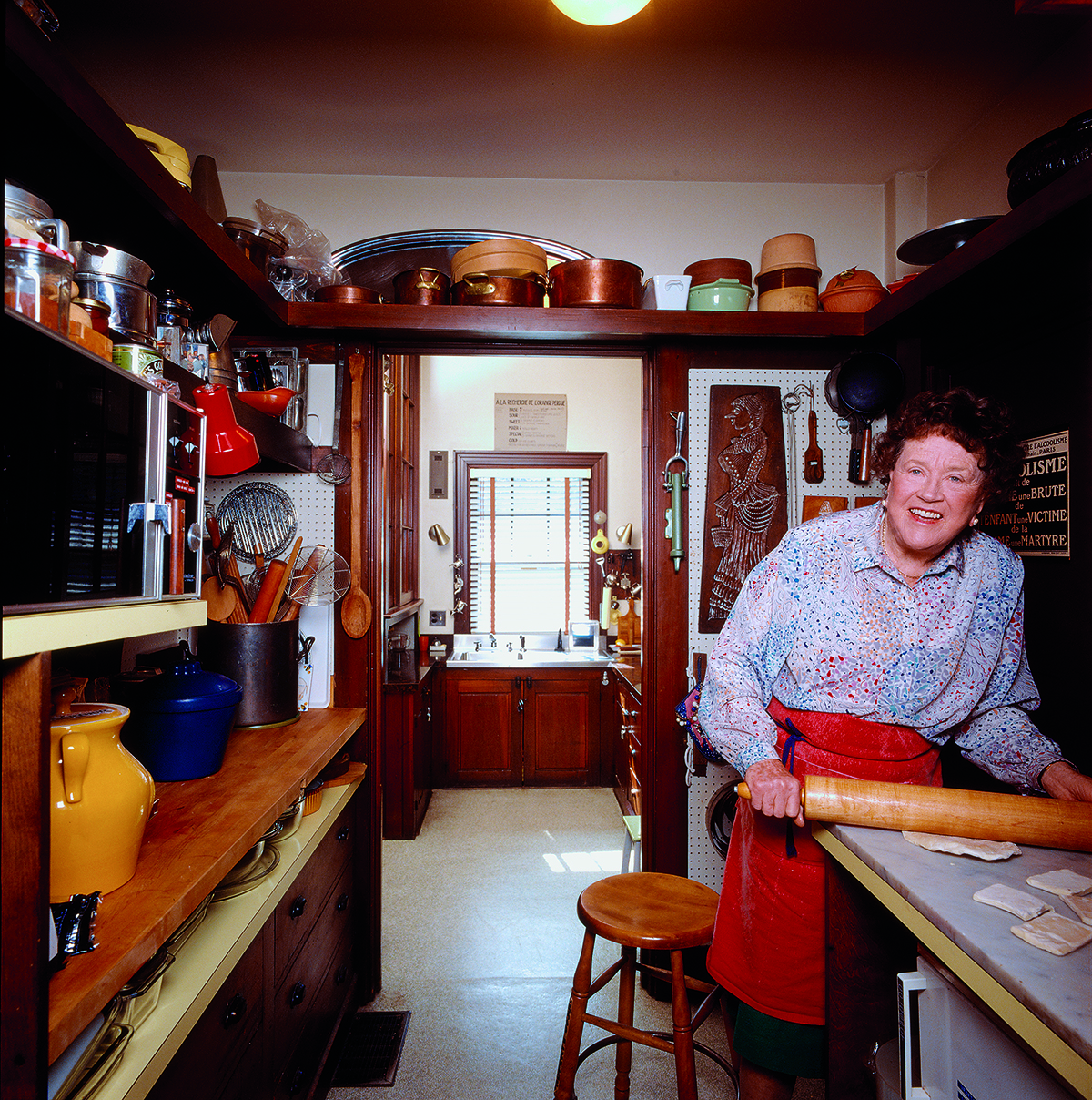 Julia Child rolling pastry in one of her Cambridge pantries. / Image from In Julia's Kitchen: Practical and Convivial Kitchen Design Inspired by Julia Child, by Pamela Heyne and Jim Scherer published by ForeEdge, an imprint of University Press of New England.