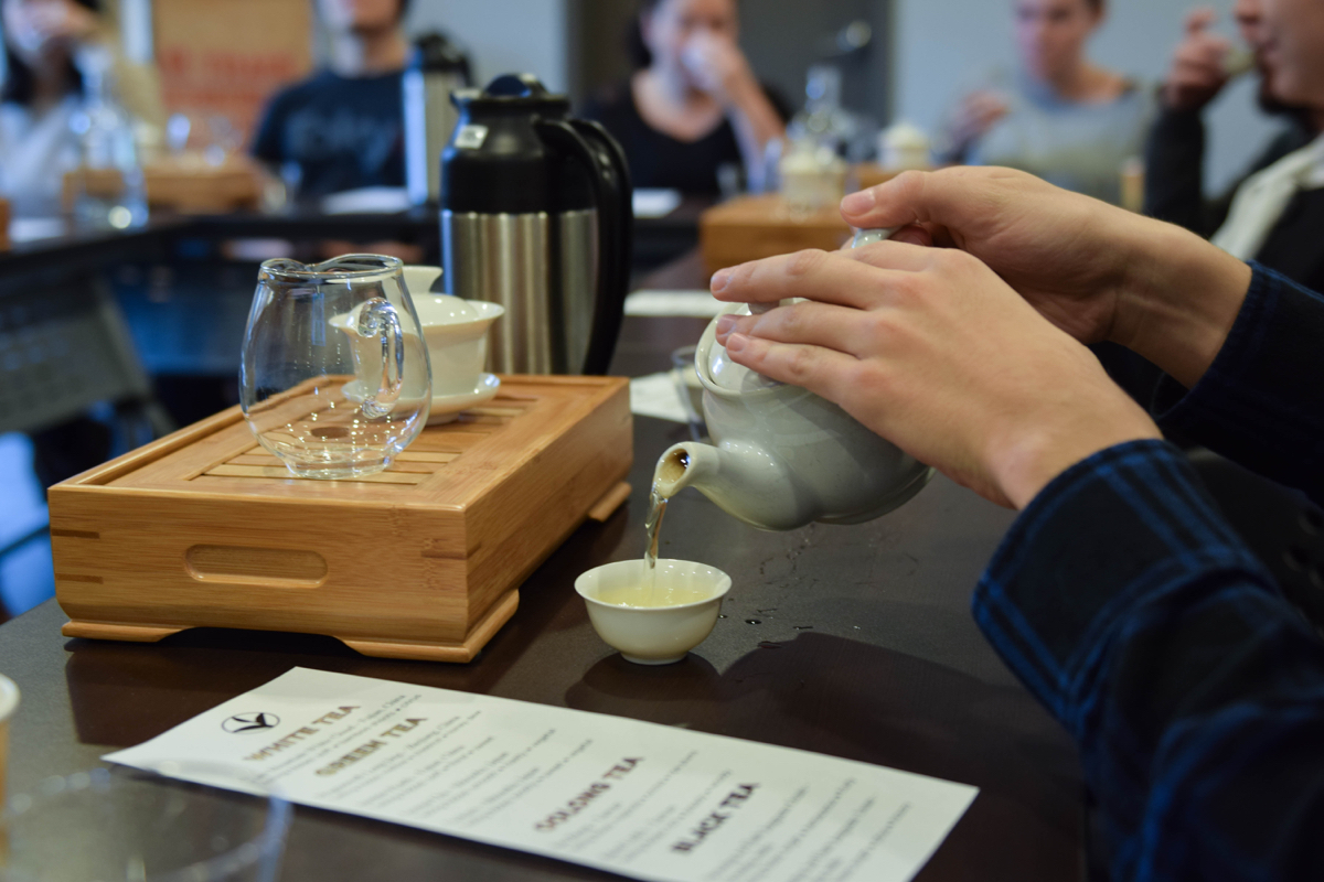MEM employee and class attendee, Alex Stand, pours a cup of a Darjeeling Oolong tea. It’s a rare kind called a “first flush,” which means it’s the first leaves picked from the tea plants in India. / Photo by Lloyd Mallison