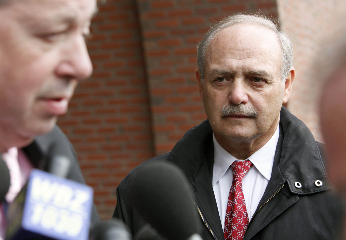 Former Massachusetts House Speaker Sal DiMasi, right, listens to his attorney Thomas Kiley outside federal court where DiMasi pleaded not guilty to federal corruption charges Thursday, Nov. 12, 2009, in Boston. (AP Photo/Michael Dwyer)