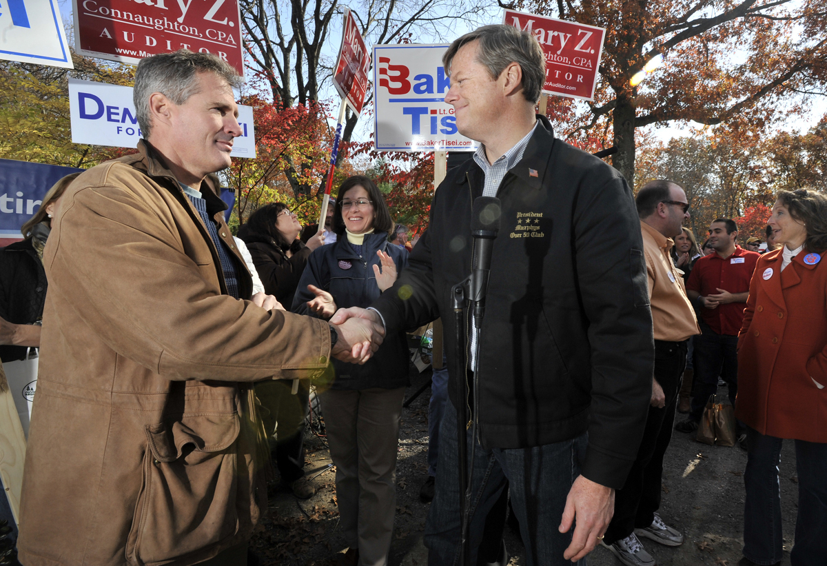 Republican gubernatorial candidate Charles Baker, right, shakes hands with Sen. Scott Brown R-Mass., left, during a campaign event on Saturday, Oct. 30, 2010, on the last weekend before the Nov. 2 Election. (AP Photo/Josh Reynolds)