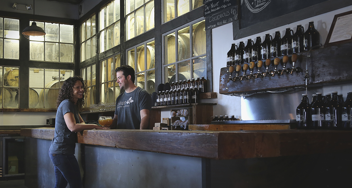 Trillium Brewing Company owners Esther and JC Tetreault inside their current Boston brewery