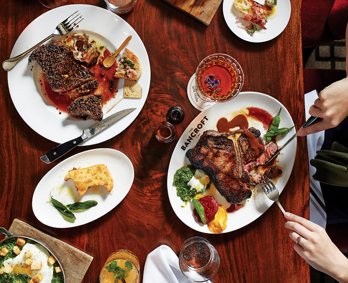 A feast of steak au poivre, bone-in Black Angus filet, and pastrami-­cured smoked salmon at the Bancroft