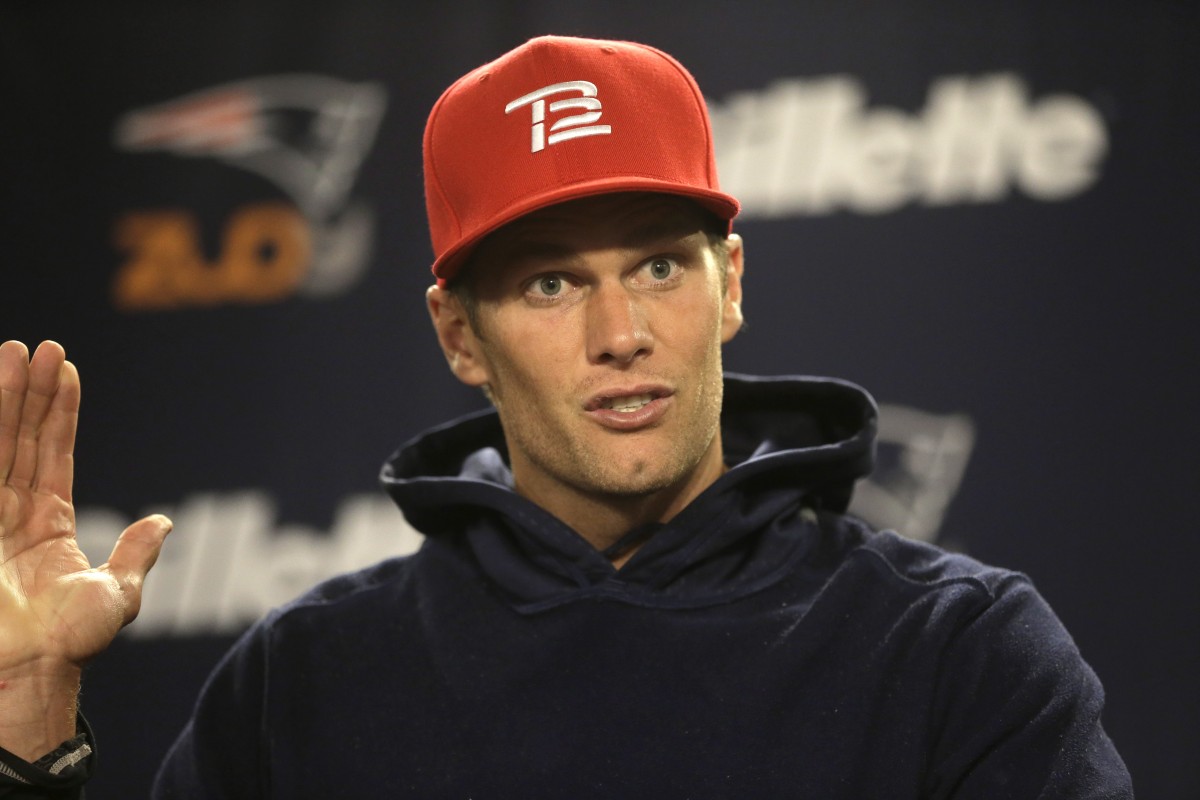 New England Patriots quarterback Tom Brady speaks with members of the media before an NFL football practice, Wednesday, Nov. 4, 2015, in Foxborough, Mass. The Washington Redskins are to play the Patriots Sunday, Nov. 8, 2015, in Foxborough. (AP Photo/Steven Senne)