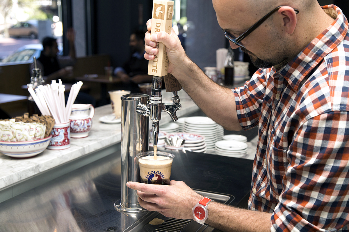 La Colombe South Station cafe manager Derek Creaig pours a 'Pure Black and tan.'